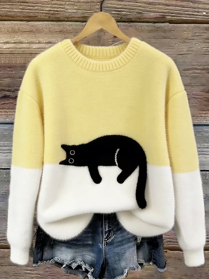 Oversize'owy sweter z nadrukiem kota